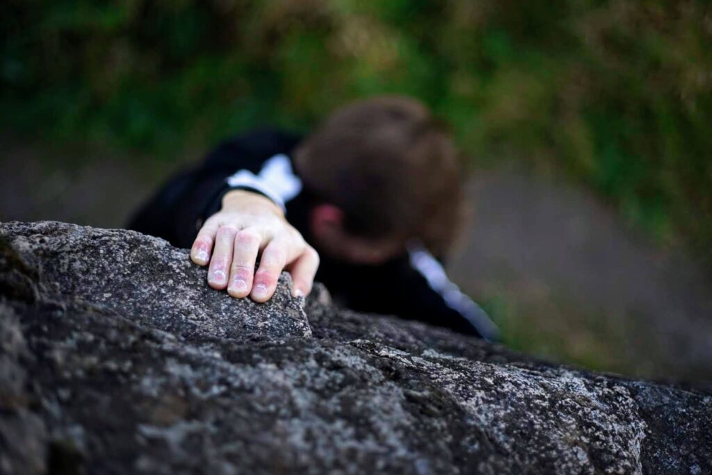 A climber climbing.