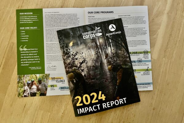 Printed impact report on a table.