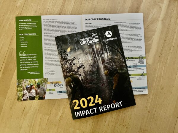 Printed impact report on a table.